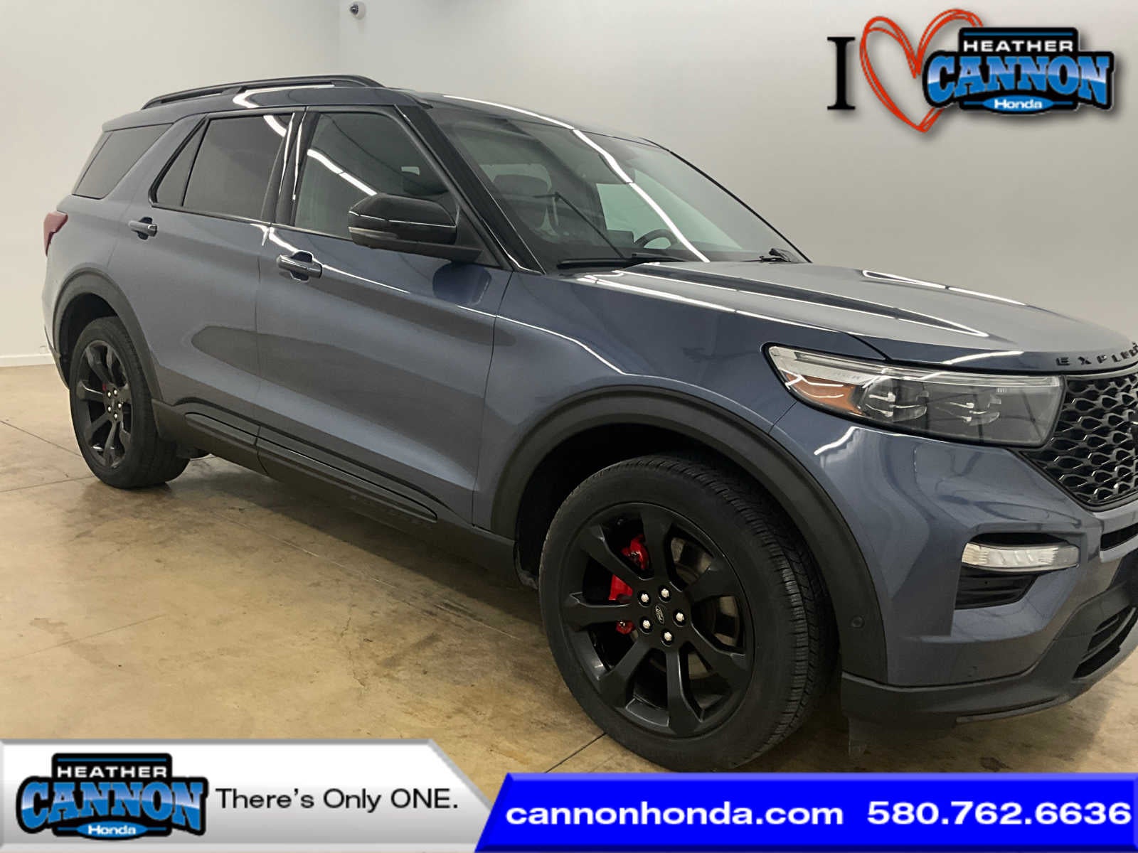 2021 Ford Explorer ST in Infinite Blue Metallic Tinted Clearcoat — front three-quarter view