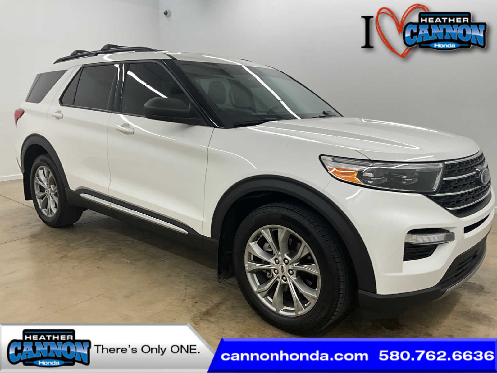 2023 Ford Explorer XLT in Star White Metallic Tri-Coat — front three-quarter view