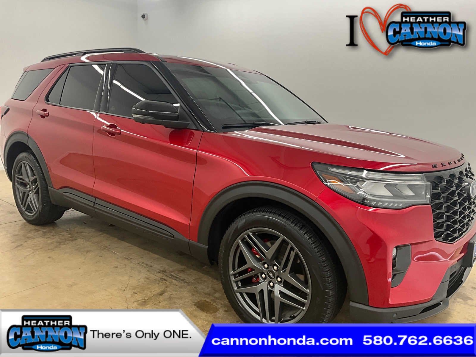 2025 Ford Explorer ST in Rapid Red Metallic Tinted Clearcoat — front three-quarter view