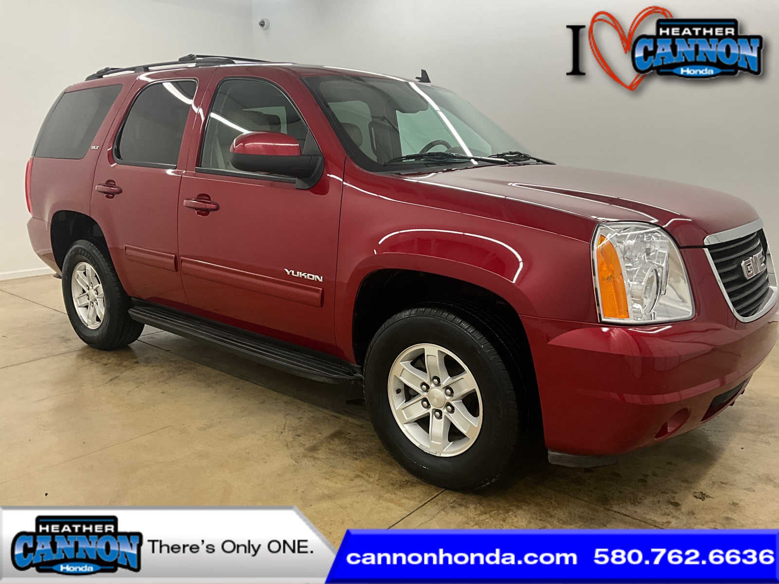 2013 GMC Yukon SLT in Crystal Red Tintcoat — front three-quarter view