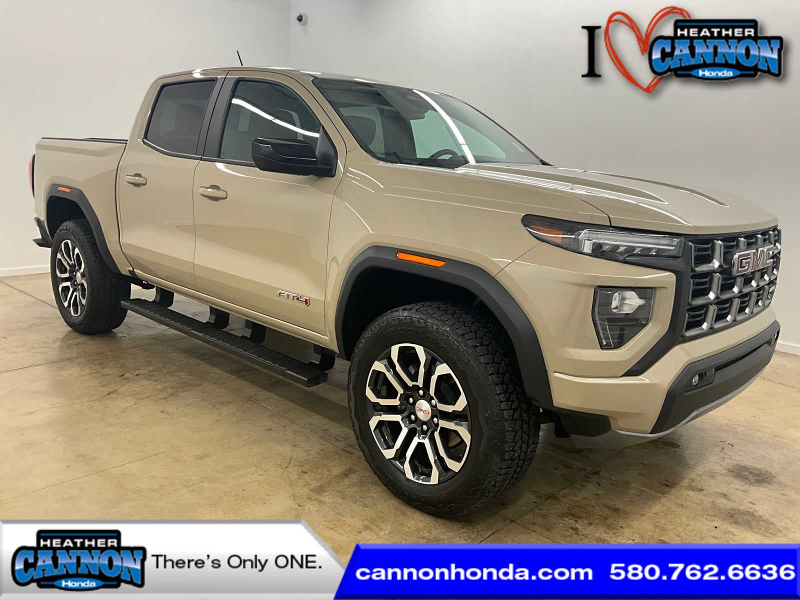 2023 GMC Canyon 4WD AT4 in Desert Sand Metallic — front three-quarter view