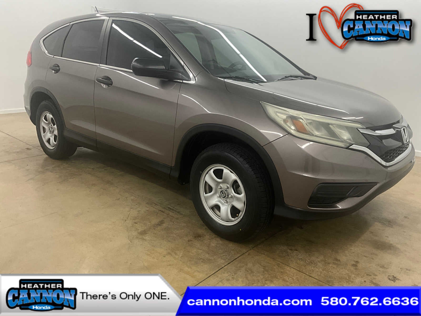 2015 Honda CR-V LX in Urban Titanium Metallic — front three-quarter view