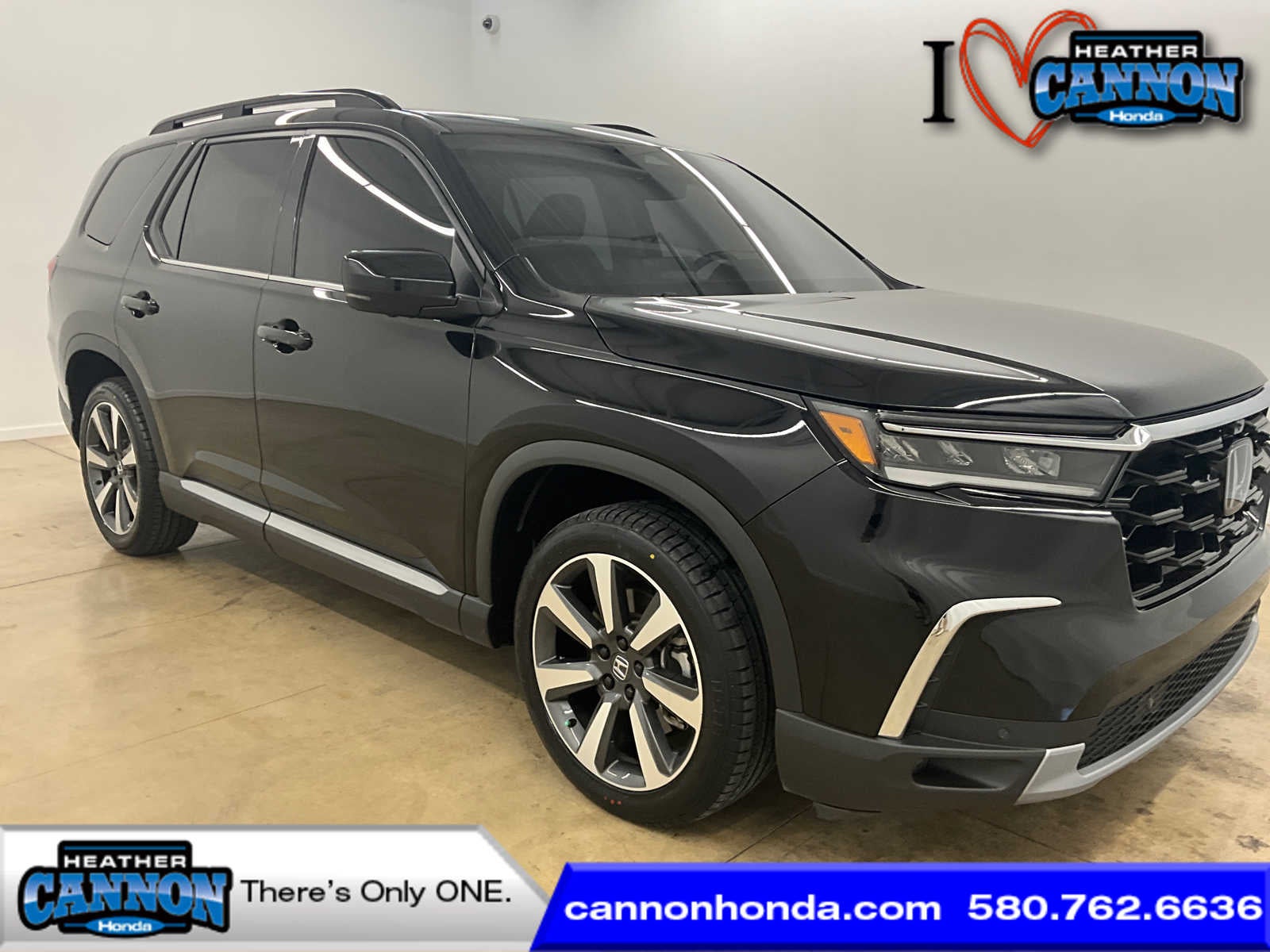 2023 Honda Pilot Elite in Crystal Black Pearl — front three-quarter view