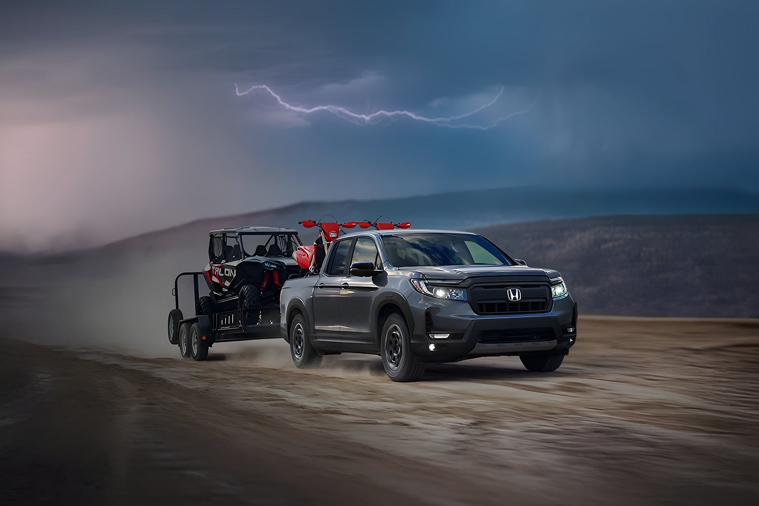 A ridgeline pullign a trailer.